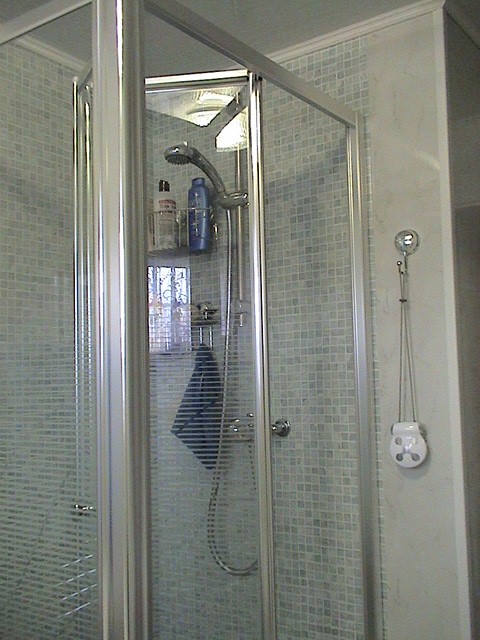 folding shower door in polished silver